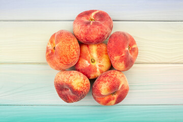 flat saturn peach on wood background top view