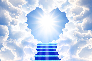 Stairs leading to light in sky through heart shaped gap in clouds. Love of God, concept