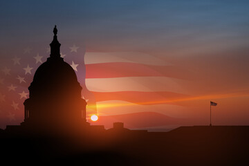 The United States Capitol building silhouette on background of sky at sunset in Washington DC, USA