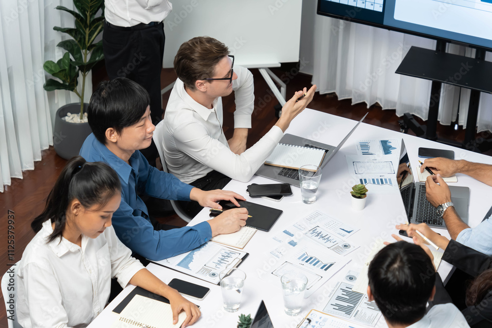 Leinwandbilder Project manager communicate and collaborate with team using project management software display on monitor, tracking progress of project task and making schedule plan at meeting table. Prudent