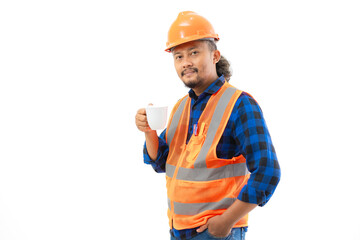 Indonesian male construction worker in full safety suit enjoying a cup of black coffee while working, construction and industry concept, isolated on white background.