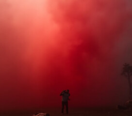 Fototapeta premium Slowly rising red smoke in realistic atmospheric conditions creates a dramatic and immersive visual effect._00001_