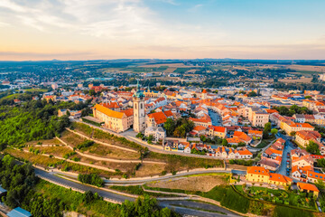 Obraz premium Melnik Castle on the hill above Labe and Vltava River in sunny day. Church with city space and square. Czech Republic.