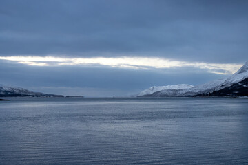 Winter landscape with ocean and mountains, Norway