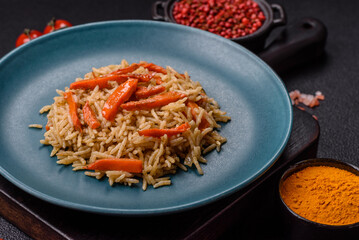 Delicious fresh pilaf with rice, carrots, meat, onions, spices and berries