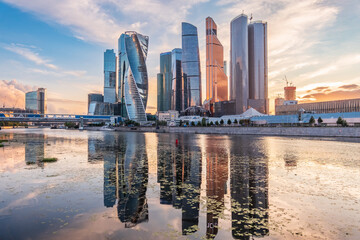 Obraz premium High buildings of Moscow-City at Moskva River at summer sunset, Russia.