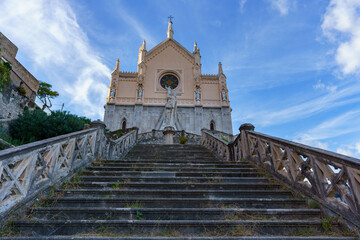 A view of the stone stairs with an abandoned church in the background.