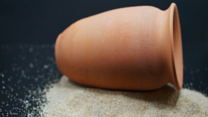 seashells Beautyful decoration with background of colorful small rocks, clay pot, class sand keepers and small magic portions 