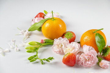  Ripe juicy strawberries and other bright fruits over white background. Minimal berries concept. Flat lay, top view, copy space