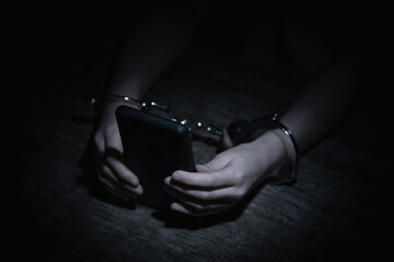 Crown of thorns and rosary beads on brown texture background with space for text