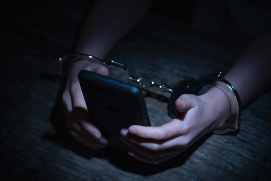 Crown of thorns and rosary beads on brown texture background with space for text