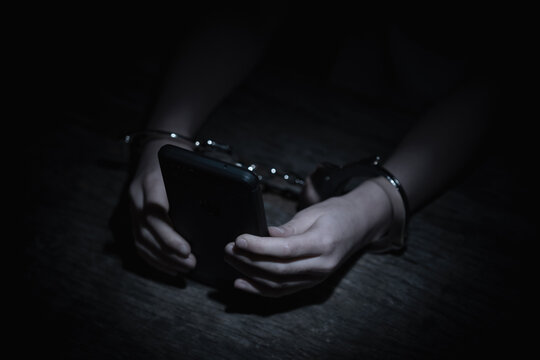 Crown of thorns and rosary beads on brown texture background with space for text