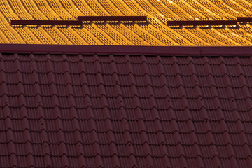 Divided Worlds: Rooftop Contrast at Sunset. Part of the house.