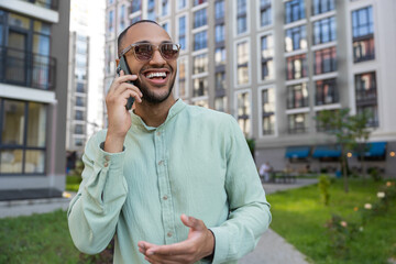 African American man having cell phone call outdoor in city street