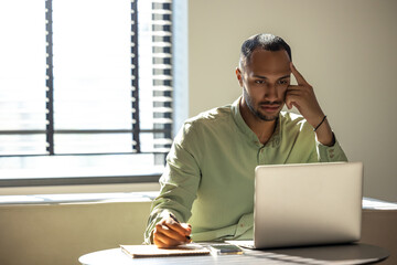 Businessman using laptop computer for working online