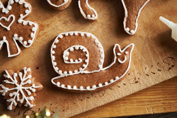 shape of a snail decorated with white icing