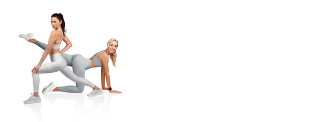 Two fitness models display dynamic workout poses in matching light gray athletic outfits. The setting highlights their strength and flexibility, promoting a healthy lifestyle.