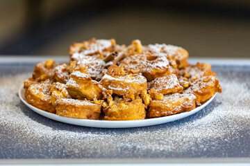 Authentic sweet Christmas French toast served with sugar and cinnamon in a Christmas atmosphere