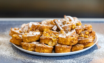 Authentic sweet Christmas French toast served with sugar and cinnamon in a Christmas atmosphere