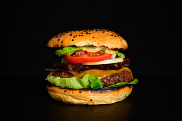 Hamburger or Cheeseburger Gourmet Wagyu Burger with Grilled Beef Patty, Tomato, Lettuce, Onion, Bacon and Cheddar Cheese in a Sesame Seed Bun