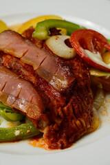 Racponty Hungarian Carp in the Style of Rac with Green Bell Peppers, Bacon, Tomatoes, Onion and Potatoes