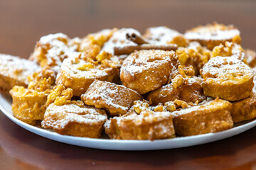 Authentic sweet Christmas French toast served with sugar and cinnamon in a Christmas atmosphere