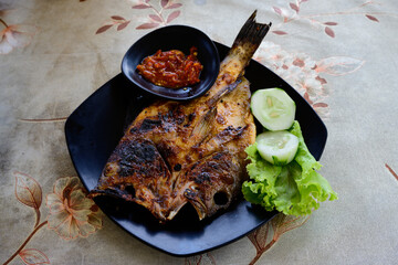 Ikan Bakar Indonesian Grilled Fish Glazed with Kecap Manis Sweet Soy Sauce and Served with Sambal Olek Chili Sauce