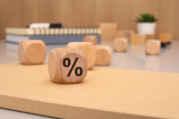 Wooden Blocks Displaying the Percentage Symbol on a Desk Representing Financial Concepts and Ideas