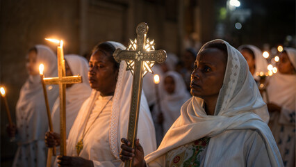 Women holding candles during a religious procession in a dimly lit church