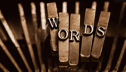 Vintage typewriter keys spelling out the word Words in a close-up image