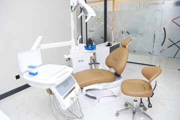 Patient chair used by  professionals for treatment and tools used by doctors in dental procedures. Dental treatment instruments and dental clinic. dental hospital and clinic