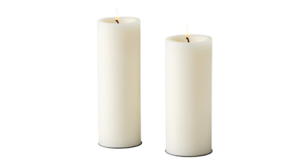 PNG of Two elegant white candles softly glowing in a dark space on transparent background