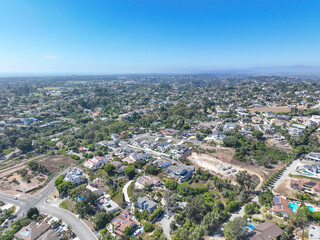 Aerial view of middle class houses in the valley of Oceanside town in San Diego, California. USA.