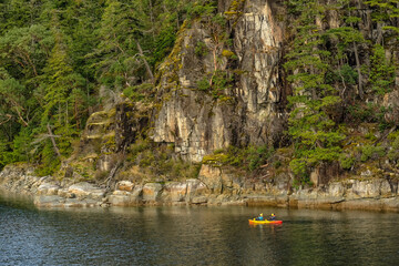 Kayakers exploring the British Columbia coast; Canada