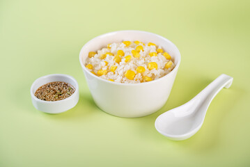 Asian corn rice in a bowl with cucumber salad