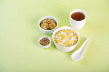 Asian corn rice in a bowl with cucumber salad