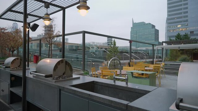 A modern and stylish outdoor kitchen providing a stunning view of the cityscape