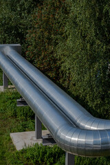 close-up of large silver pipes for district heating
