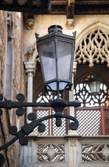 Old street lantern lighting on facade of building. City street, building illumination. Retro lantern lighting Street lights, illumination and vintage lantern.