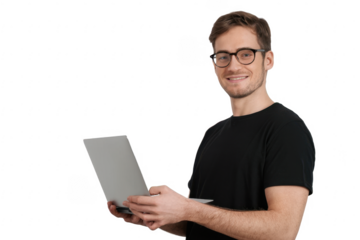Portrait of young man in black t-shirt standing, holding laptop with happy smile
