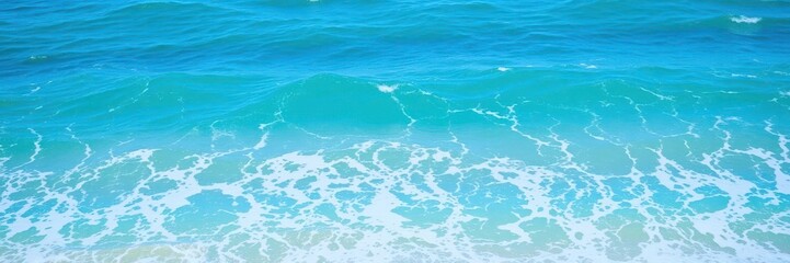 Ocean waves crash against the shore, creating a beautiful turquoise water texture filled with foam and energy, nature, summer