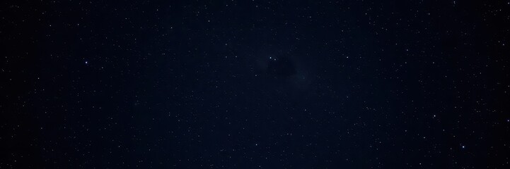 Fototapeta premium Starry night sky full of sparkling stars against a black background, space, stars, celestial
