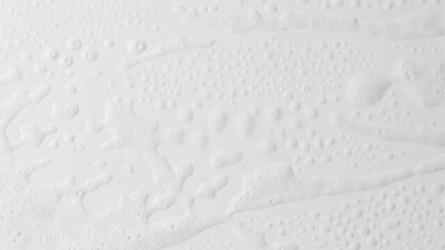 Abstract background white soapy foam texture. Shampoo foam with bubbles