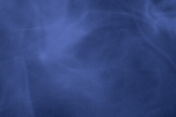 Abstract composition of soft purple smoke patterns flowing gently, creating a dreamy and tranquil atmosphere with subtle motion and texture.