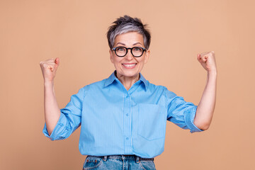 Photo of gray hair retired experienced business lady wearing formalwear raised fists up strong...