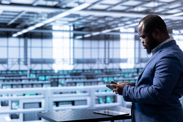 Admin in data center checking storage units and infrastructure components, doing maintenance....