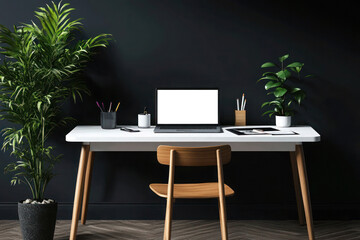 Minimalist home office with a mockup of a blank computer screen sitting on a white desk set against a dark wall.