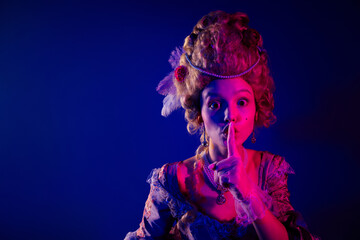 Photo of gorgeous pretty lady dressed pompous rococo costume finger mouth asking keep silence blank space isolated neon light background