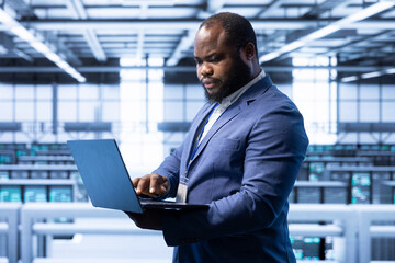 Software developer in data center monitoring system performance, identifying bottlenecks and implementing optimizations. Supervisor in high tech server hub workspace troubleshooting bugs