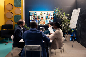 Executive board attending videocall online with shareholders, meeting to address enterprise issues...